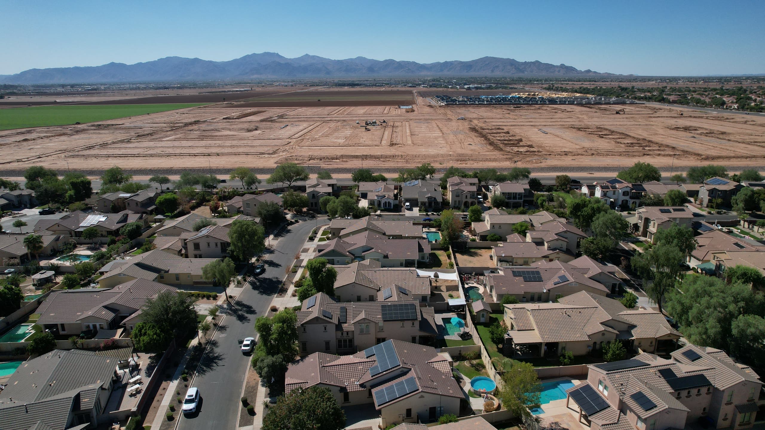 Graded land for new development beside an established neighborhood